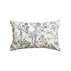 a blue and white pillow with birds on it