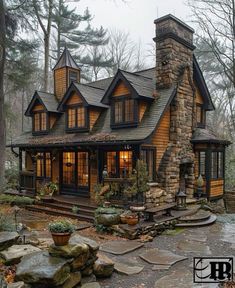 a house in the woods with stone steps leading up to it