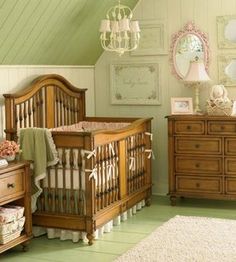 a baby's room with a crib, dressers and other furniture in it