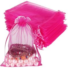 a pink organ bag filled with lots of beads