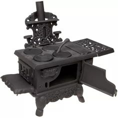 an old fashioned cast iron stove with pots and pans