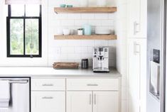 the kitchen is clean and ready to be used as a place for coffee or tea