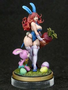 a figurine is shown with an apple and rabbit on it's back