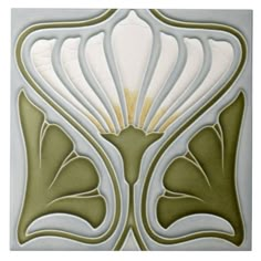 an art deco tile design in green and white