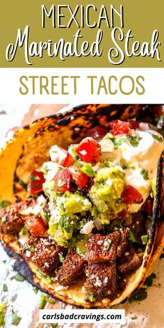 mexican marinated steak street tacos with guacamole and tomatoes