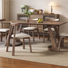 a dining room table with four chairs around it