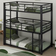 a bunk bed with two sets of mattresses on the bottom and one is green