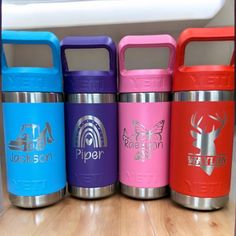 thermos are lined up next to each other