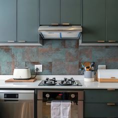 a stove top oven sitting inside of a kitchen