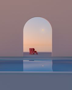 a red chair sitting on top of a blue pool next to an open doorway at sunset