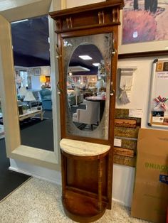 an antique grandfather clock in the middle of a store