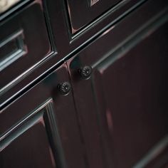 an image of a bathroom vanity with dark wood