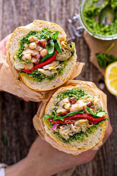 the ultimate vegan antipasto sandwich is loaded with fresh vegetables and chickpeas