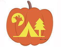 an orange pumpkin with a tent and trees on it