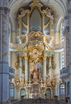 the interior of a church with an ornate organ