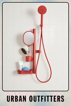 a red shower faucet with the words urban outfitters above it