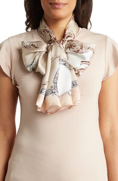 Luxuriously soft silk defines this elegant scarf, covered in a Victorian-inspired print. 68" x 20" 100% silk Dry clean Imported Cream Silk Scarf For Formal Occasions, Luxury Beige Scarf For Formal Occasions, Luxury Beige Formal Scarf, Chic Silk Shawl Scarf, Chic Beige Silk Scarf, Elegant Cream Scarf For Formal Occasions, Formal Silk Scarves For Spring, Formal Beige Silk Scarf For Spring, Formal Beige Silk Scarf