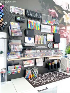 the wall is decorated with many different types of art supplies