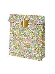 a flowered box with a gold handle on the front and bottom, it is made out of paper