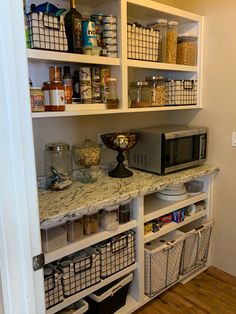 an organized pantry with lots of items on the shelves