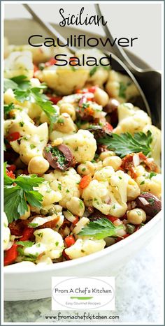 a white bowl filled with cauliflower salad and garnished with parsley