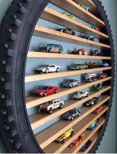 there are many toy cars on the shelves