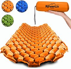 an inflatable mattress is being held by a hand