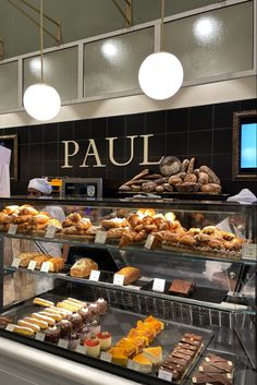 a display case filled with lots of different types of pastries