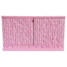 a pink cabinet with two doors on it