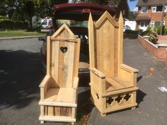 two wooden benches sitting in the back of a car