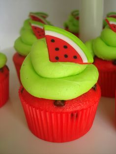 cupcakes decorated with green icing and watermelon slices