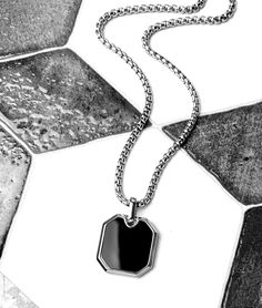 "《《  FOR YOUR JOURNEY COLLECTION  》》 THE DETAILS The \"BLACK ONYX AMULET\" Necklace is designed with an exquisitely detailed Silver Stainless Steel Octagon Pendant, with a rich Black Onyx Gemstone Inlay, hung from a Silver Stainless Steel Box Chain available in your choice of length! GEMSTONE BENEFITS BLACK ONYX: Known as the \"PROTECTION\" Stone, often worn for its abilities to harness one's inner strength while increasing self control and self discipline, to encourage an increased focus and at Elegant Black Jewelry For Father's Day, Minimalist Black Jewelry For Father's Day, Classic Black Jewelry With Chain Detail, Classic Black Chain Jewelry, Formal Black Stainless Steel Necklace, Father's Day Black Metal Jewelry, Formal Black Rectangular Necklace, Father's Day Black Engraved Jewelry, Black Metal Jewelry With Box Chain