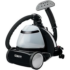 a black and white steam iron on a white background with the words conair above it