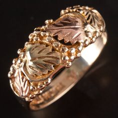 10k Black Hills Gold Tri-Color Floral Leaf Style Ring 4.59gMetal Information: 10k Black Hills Gold ( Yellow / Red / Green)Total Weight: 4.59gBand Width: 3.6mmSize: 10.75Estimated Retail Price: $520.00OUR PRICE: $415.00SizingMany of our pieces can be re-sized at the buyers request. Please email us if you require our skilled professional services.45892 Black Hills Gold, Black Hills, Professional Services, Gold Yellow, Tri Color, Fashion Rings, Red Green, Ring, Yellow