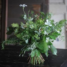 a bouquet of flowers sitting on top of a table