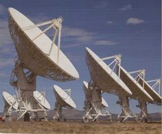 several large array of satellite dishes in the desert