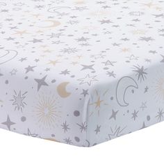 a bed sheet with stars and moon designs on it