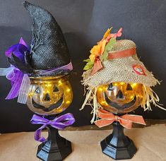 two pumpkins with hats on top of them