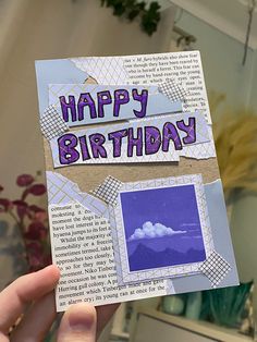 someone is holding up a birthday card with pictures on it and the words happy birthday