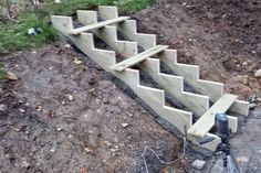 the stairs are made out of concrete and wood