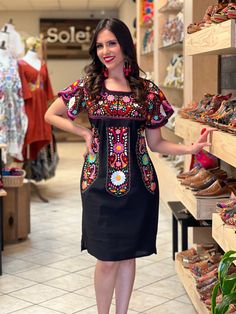 This Beautiful Dress boasts a Traditional Mexican floral design combined with a modern style dress. The colorful flowers combined with the split sleeve design make it fun and flirty. It's made out of fine Mexican cotton, is completely embroidered by hand with cotton string and some knit details. This dress is handmade and hand embroidered by Mexican Artisans in Puebla, Mexico. Purchase the earrings modeled here: https://www.etsy.com/es/listing/1095308086/arete-artesanal-mexicano-aretes?ref=listi Mexican Theme Party Outfit Women, Mexican Party Dress, Formal Wrap Dress, Fav Outfit, Split Sleeve Dress, Hand Embroidered Dress, Traditional Mexican Dress, Embroidered Heels, Coco Dress