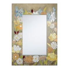 a mirror with flowers painted on it and a white frame in the middle is shown