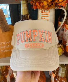 Pumpkin Season Hat Embrace the cozy vibes of autumn with our stylish Pumpkin Season Hat! This khaki-colored foam and mesh trucker hat is designed to keep you cool and comfortable while celebrating your favorite time of year. The front proudly displays "Pumpkin Season" in bold varsity letters, adding a touch of nostalgic charm to your fall wardrobe. With its adjustable back, this hat ensures a perfect fit for adults of all sizes. Whether you're heading to the pumpkin patch, sipping on a spiced la Fall Trucker Hat, Varsity Letters, Boho Bandeau, Autumn Walk, Fall Hat, Sweet Grace, Country Clothing, Fall Hats, Candle Mat