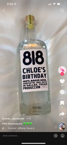 a bottle of vodka with the number eight on it's label in front of a white sheet