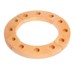 a wooden ring with holes in the middle