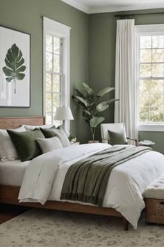 a bedroom with green walls and white bedding