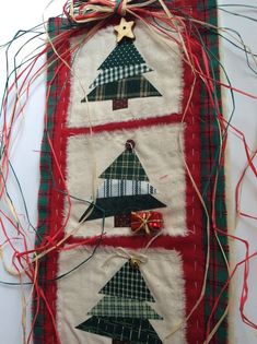 a wall hanging with christmas trees on it