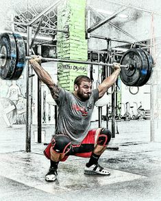 a man is squatting while holding a barbell