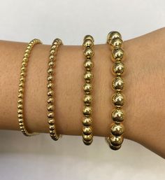 These beautiful 14k gold ball bracelets are a perfect casual chic style that's going to be added to your collection!  They come in 4 different millimeters in 14k yellow gold. All lengths are 7.5'' with 8'' extension with lobster lock  Real 14k  Not plated  Weight : 3mm -3.7g 4mm -3.3g 6mm -11.5g 7.7mm- 14.6g Ball Bracelet, Casual Chic Style, Solid Yellow, Arm Band, Halloween Shopping, Casual Chic, Chic Style, Jewelry Bracelets, Beaded Bracelets