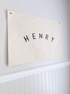 a sign that reads henry hanging on the wall